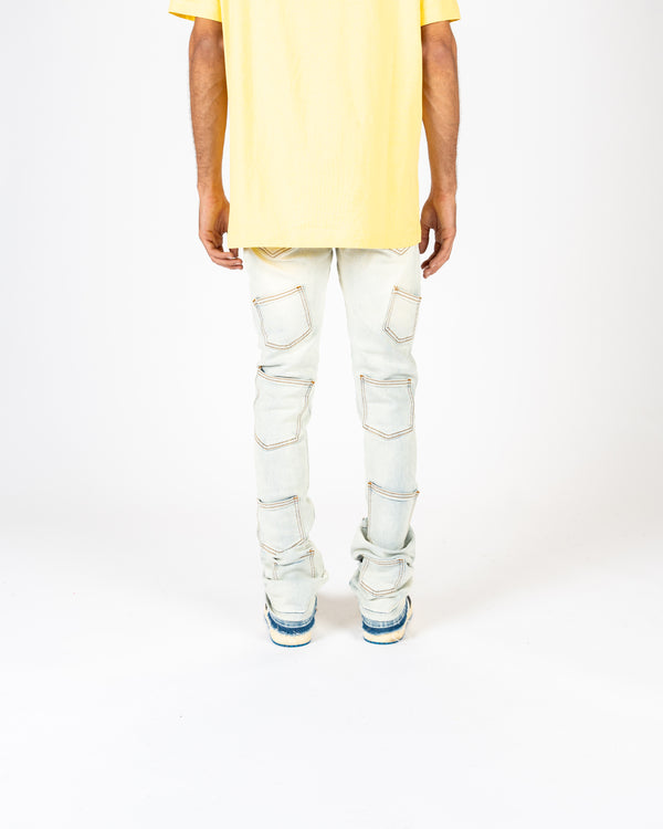 'EMOTIONALLY NUMB" FLARE STACK DENIM